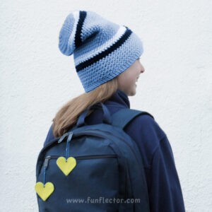 backpack with yellow and blue heart safety reflectors by funflector