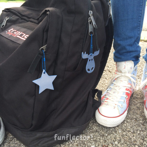 Backpack with blue moose and star safety reflectors by funflector