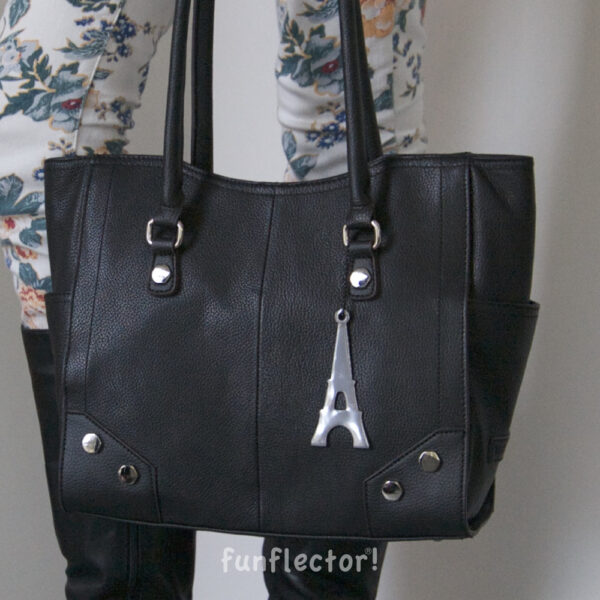 Eiffel Tower safety reflector on black leather bag by funflector
