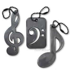 Musical trio safety reflector with black treble clef, bass clef and note by funflector