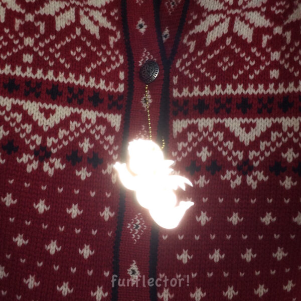 Linzer Engerl guardian angel safety reflector on Norwegian sweater at night