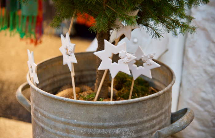 Even the Christmas tree pot get its own decoration: ceramic stars on sticks.