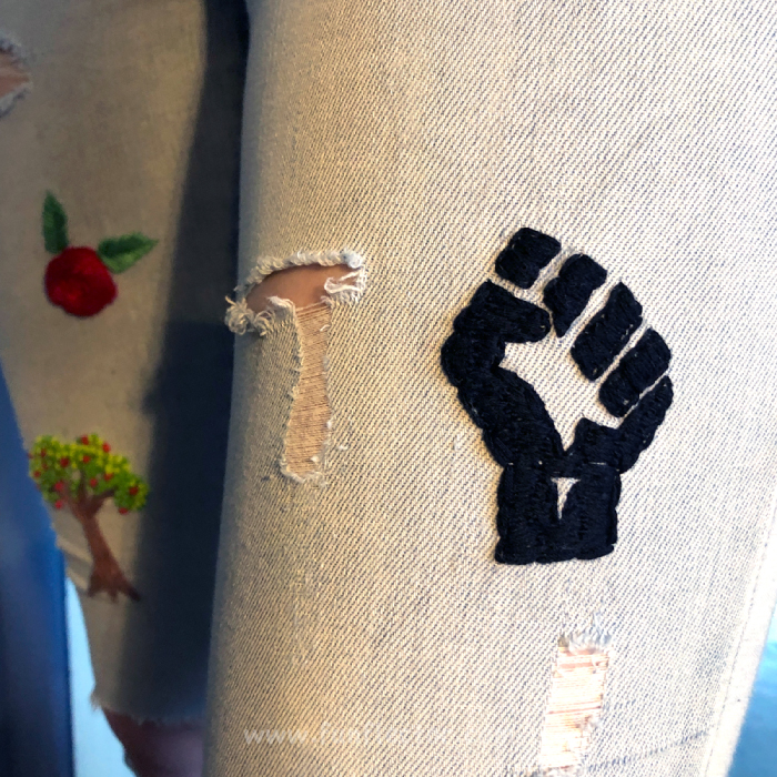 Black Lives Matter symbol embroidered on a pair of jeans. 