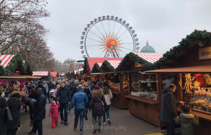 The Christmas market by the red town hall (Rotes Rathaus) in Berlin on a cloudy and cold day.