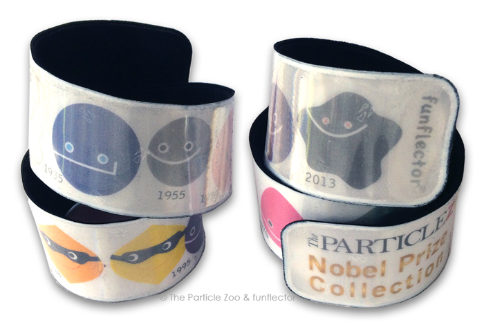Two difference views of the reflective slap bracelet with the Particle Zoo Nobel Prize collection of elementary particles.