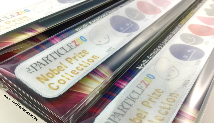 Reflective slap bracelet with the Particle Zoo Nobel Prize collection of elementary particles.