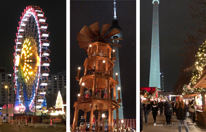 Ferris wheel, giant wooden Christmas pyramid and decorated booths at the Christmas market by the red town hall (Rotes Rathaus) in Berlin.