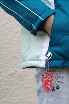 Safety reflector hanging on kid's jacket