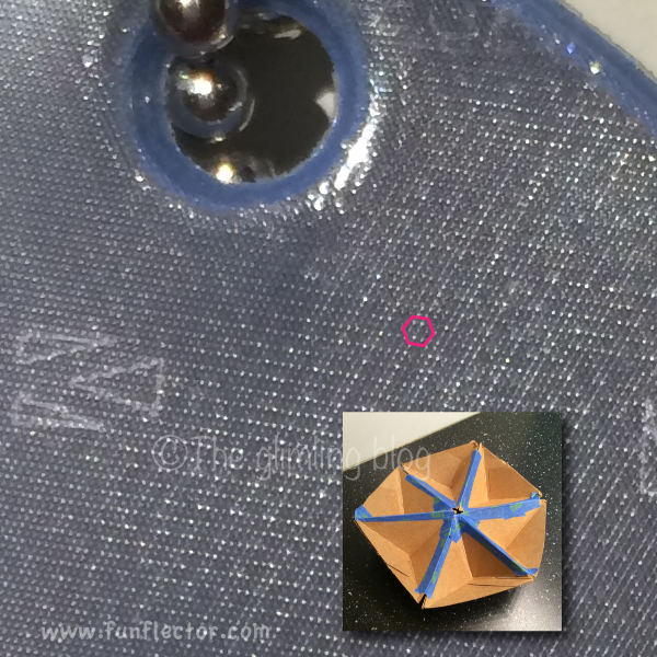 You can see here how the reflective material has a hexagonal pattern of micro prisms! Photo taken with a smartphone.