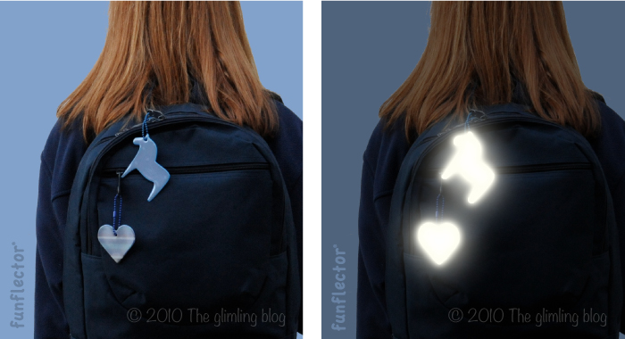 Horse and heart safety reflectors on school backpack.