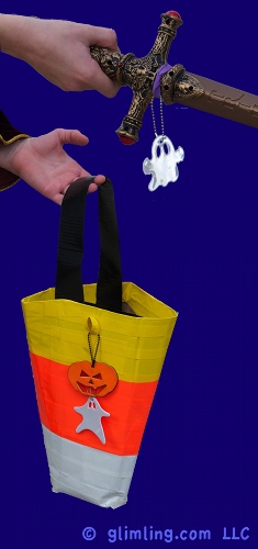 Attach safety reflectors to Halloween accessories with tape or rubber bands