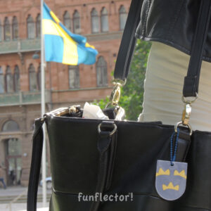 Tre kronor, three crowns safety reflector on purse in Sweden